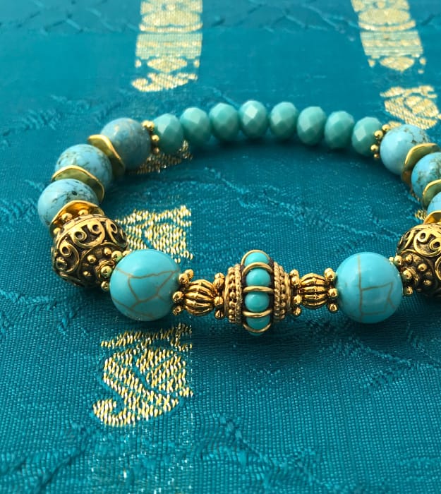 Boho stretch armband in turquoise met goud - Afbeelding 4